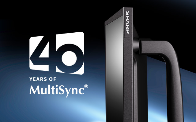 40th anniversary logo next to a Sharp MultiSync display